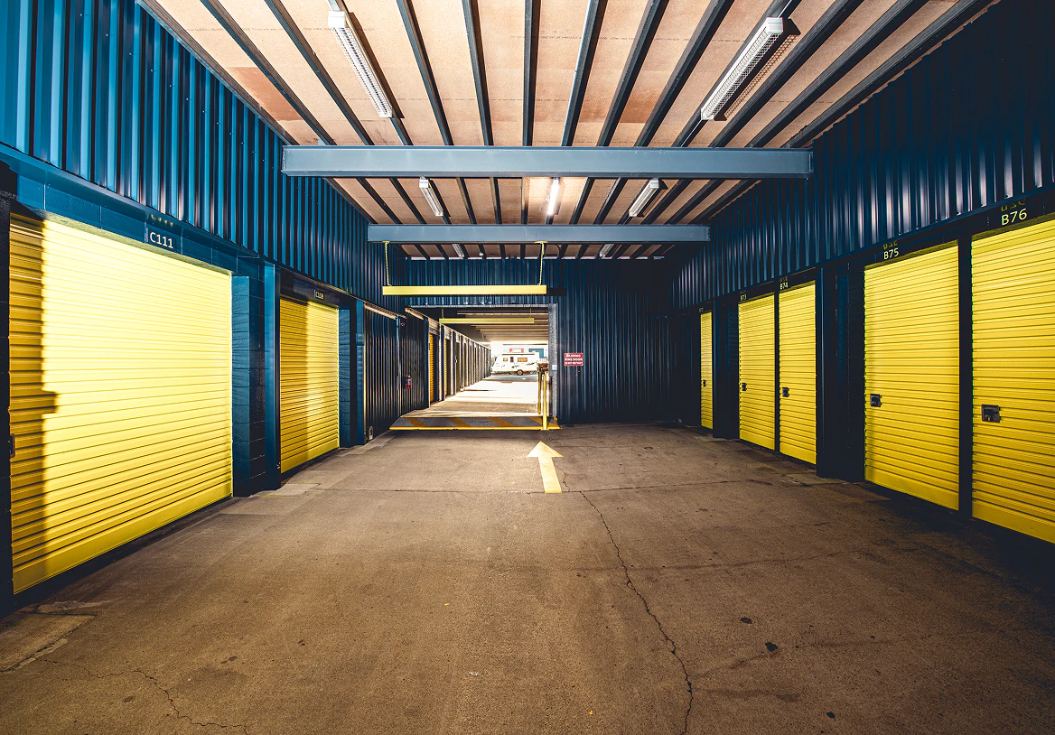 Cars parked inside a covered Storage Choice vehicle storage shed